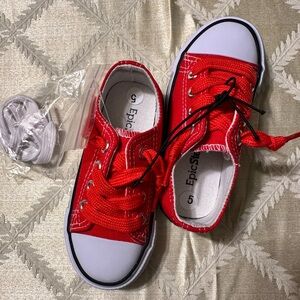 Kid’s red canvas sneakers